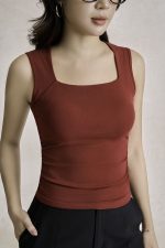 Cotton knitted shirt with round neck and ruffled waist