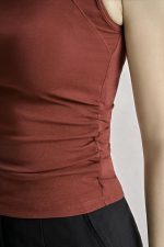 Cotton knitted shirt with round neck and ruffled waist