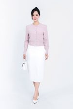 High-end fashion shimmer sweater with round neck and decorative stone buttons