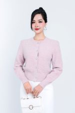 High-end fashion shimmer sweater with round neck and decorative stone buttons