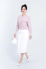 High-end fashion shimmer sweater with round neck and decorative stone buttons