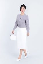 High-end fashion shimmer sweater with round neck and decorative stone buttons