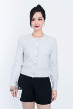 High-end fashion shimmer sweater with round neck and decorative stone buttons