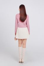 High-end fashion sweater with German collar and chest, faux-panelled pockets and high-quality stone buttons