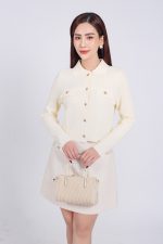 High-end fashion sweater with German collar and chest, faux-panelled pockets and high-quality stone buttons