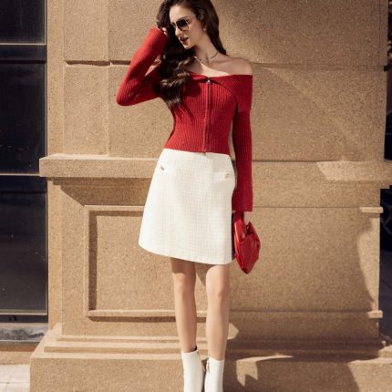 High-end fashion sweater with off-the-shoulder shape, flared sleeves and front zip