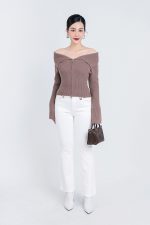 High-end fashion sweater with off-the-shoulder shape, flared sleeves and front zip