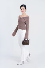 High-end fashion sweater with off-the-shoulder shape, flared sleeves and front zip