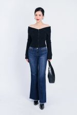 High-end fashion sweater with off-the-shoulder shape, flared sleeves and front zip