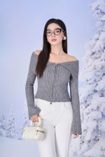 High-end fashion sweater with off-the-shoulder shape, flared sleeves and front zip