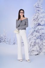 High-end fashion sweater with off-the-shoulder shape, flared sleeves and front zip