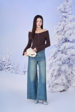 High-end fashion sweater with off-the-shoulder shape, flared sleeves and front zip