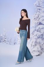 High-end fashion sweater with off-the-shoulder shape, flared sleeves and front zip