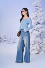 High-end fashion sweater with off-the-shoulder shape, flared sleeves and front zip