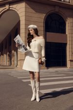 High-end fashion sweater with off-the-shoulder shape, flared sleeves and front zip