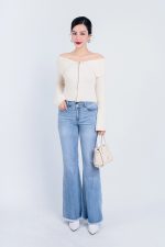 High-end fashion sweater with off-the-shoulder shape, flared sleeves and front zip