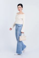 High-end fashion sweater with off-the-shoulder shape, flared sleeves and front zip