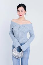 High-end fashion sweater with off-the-shoulder shape, flared sleeves and front zip