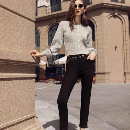 High-end fashion sweater with round neck, slightly puffed sleeves and buttoned front