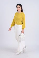 High-end fashion sweater with round neck, slightly puffed sleeves and buttoned front