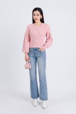 High-end fashion sweater with round neck, slightly puffed sleeves and buttoned front