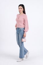 High-end fashion sweater with round neck, slightly puffed sleeves and buttoned front