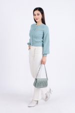 High-end fashion sweater with round neck, slightly puffed sleeves and buttoned front