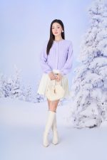 High-end fashion sweater with round neck, slightly puffed sleeves and buttoned front