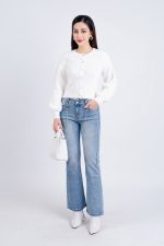 High-end fashion sweater with round neck, slightly puffed sleeves and buttoned front