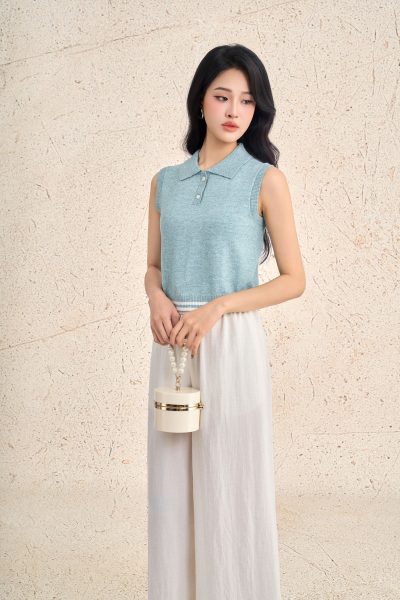 High-end sweater with round neck and sleeveless buttoned hem with line pattern