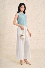 High-end sweater with round neck and sleeveless buttoned hem with line pattern