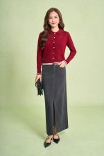 High-end sweater with V-neck, long sleeves, and striped hem to create a button-front style
