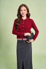 High-end sweater with V-neck, long sleeves, and striped hem to create a button-front style