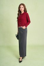 High-end sweater with V-neck, long sleeves, and striped hem to create a button-front style