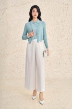 High-end sweater with V-neck, long sleeves, and striped hem to create a button-front style