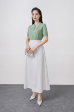 High-quality knitted sweater with German collar and buttoned sleeves, fashionable fitted hem