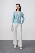 High-quality knitted sweater with V-neck, plaid pattern, and fashionable stone buttons with pockets