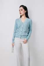 High-quality knitted sweater with V-neck, plaid pattern, and fashionable stone buttons with pockets