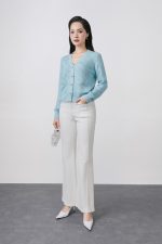 High-quality knitted sweater with V-neck, plaid pattern, and fashionable stone buttons with pockets
