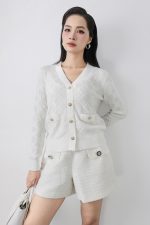 High-quality knitted sweater with V-neck, plaid pattern, and fashionable stone buttons with pockets