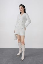 High-quality knitted sweater with V-neck, plaid pattern, and fashionable stone buttons with pockets