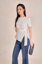 Peplum cotton t-shirt with crew neck, short sleeves and side flap
