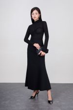 Wool knitted shirt with high neck, long sleeves and puffy chest