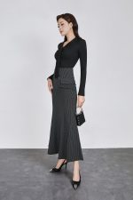 Wool knitted T-shirt with a V-neck cut and a flap to create a fashionable bustier style