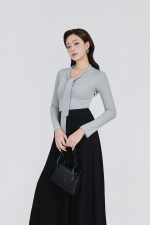 Wool knitted T-shirt with a V-neck cut and a flap to create a fashionable bustier style