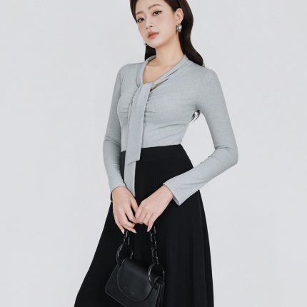 Wool knitted T-shirt with a V-neck cut and a flap to create a fashionable bustier style