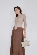 Wool knitted T-shirt with a V-neck cut and a flap to create a fashionable bustier style