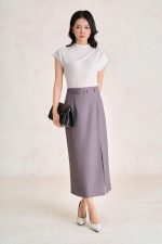 Wool knitted t-shirt with round neck and shoulder sleeves, styled with a shrug