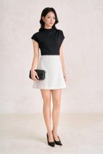 Wool knitted t-shirt with round neck and shoulder sleeves, styled with a shrug