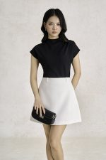 Wool knitted t-shirt with round neck and shoulder sleeves, styled with a shrug